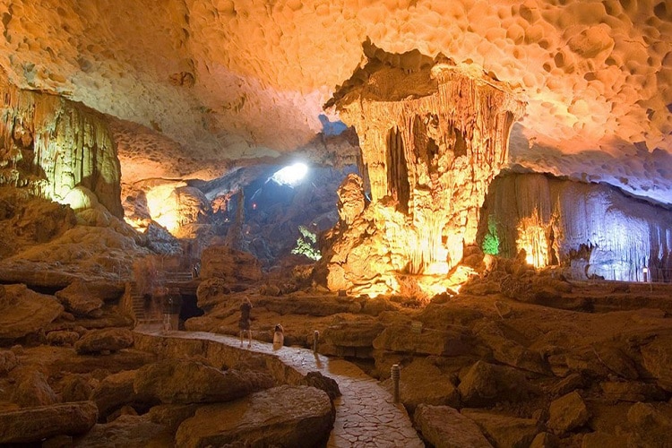 things to do in halong bay - discover hidden grottos and caves