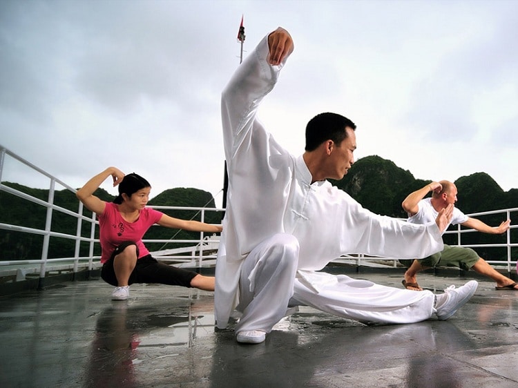 things to do in halong bay - practice tai chi on deck